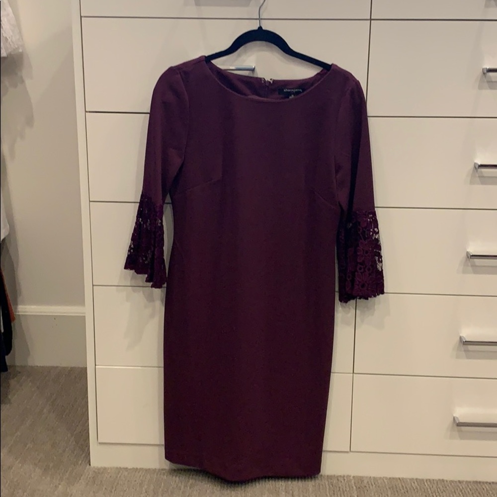 Cute plum dress with bell lace sleeves.